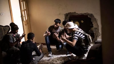Free Syrian Army fighters pray before beginning an operation against the Syrian Army positions in the Amriya district in Aleppo.