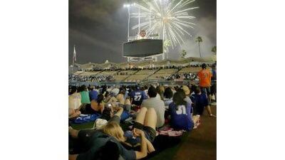 Fireworks at ballparks, such as this one in Los Angeles, draw crowds on the Fourth of July.