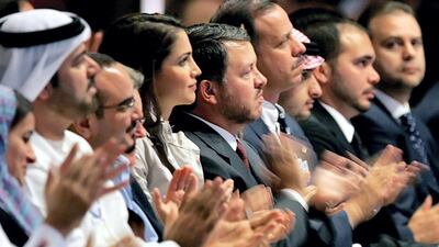 King Abdullah II, centre, and his wife Queen Rania, left, applaude with other officials following a speech by Sheikh Mohammed bin Rashid at the World Economic Forum in 2007. AFP