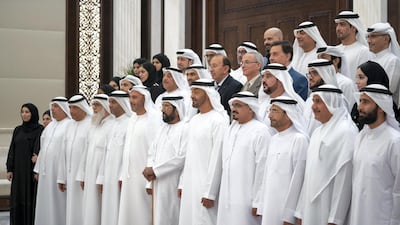 Sheikh Mohamed bin Zayed, Crown Prince of Abu Dhabi and Deputy Supreme Commander of the Armed Forces (5th R) and Sheikh Tahnoon bin Mohamed Al Nahyan, Ruler's Representative in Al Ain (6th R), stand alongside members of the Ministry of Health. Mohamed Al Hammadi / Ministry of Presidential Affairs