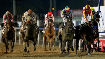 Jockey Victor Espinozae riding Secret Circle wins the Gulf News Cup during the Dubai World Cup at the Meydan Racecourse in Dubai. ( Satish Kumar / The National )