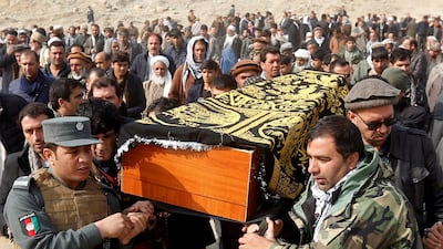 Afghan men carry the coffin of one of the victims of the bomb attack in Kabul, Afghanistan / Reuters