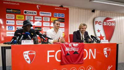 Mario Balotelli with FC Sion communications manager Baptiste Coppey and sport director Barthelemy Constantin during the striker's press conference at the Stade de Tourbillon. EPA