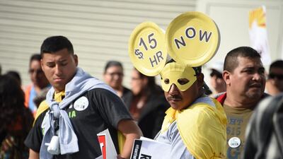 American fast-food workers, healthcare workers and their supporters march in Los Angeles on December 4, 2014, as part of a nationwide protest to demand an increase in the minimum wage to US$15 per hour. Robyn Beck / AFP