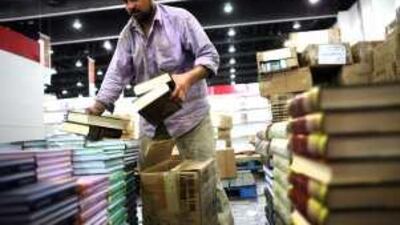 Said Rasheed of the University Book Shop prepares for the Abu Dhabi Book Show.