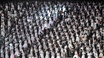 Couples attend a mass wedding ceremony organised by the Unification Church at Cheongshim Peace World Center in Gapyeong. AFP