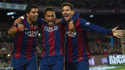 Lionel Messi, right, Neymar, centre, and Luis Suarez, left, have formed the most prolific strike unit in world football. Siu Wu / AP Photo