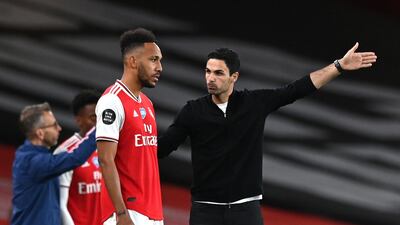 Mikel Arteta speaks to Pierre-Emerick Aubameyang. PA