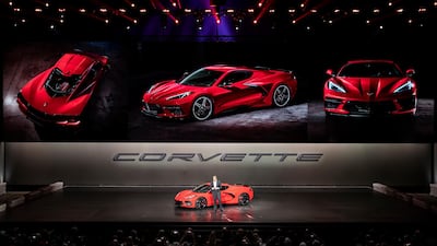 Mark Reuss delivers a speech alongside the next generation Corvette. EPA