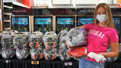 Helmets and race suits are individually wrapped in plastic. Aaron Meriwether