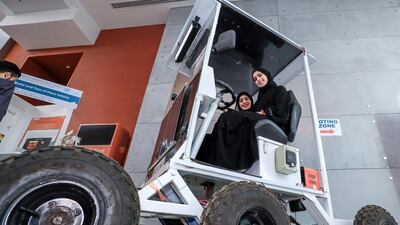 Fatima Alnaimi and Anoud Al Katheeri show off their Mars vehicle design at Khalifa University. Victor Besa / The National