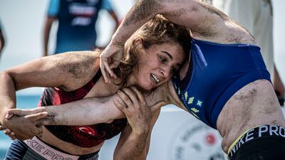 Hatice Ede Tekin (L) of Turkey wrestles Yulia Kremezna Malyk of Ukraine.