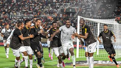 South Africa's players celebrate after Teboho Mokoena, centre, scored the second goal in their 2-0 Africa Cup of Nations last-16 victory against Morocco. AFP