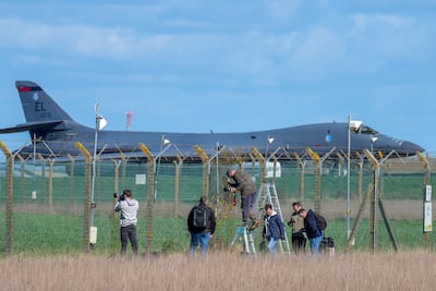Plane spotters and aviation enthusiasts look out for aircraft activity along the perimeter fence RAF Fairford on March 14, 2026 in Fairford, England, after the US began to use UK bases for its war on Iran. Getty Images