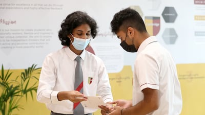 Atharv Naik, left, secured five A* grades and is looking forward to attending university in the UK. Pawan Singh / The National