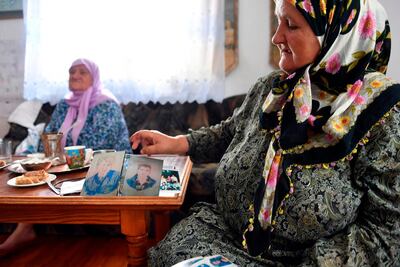 Bosnian Muslim woman Ramiza Gurdic (R), 67, survivor of Srebrenica 1995 massacre, lost her husband and two underage sons in the Srebrenica genocide. AFP