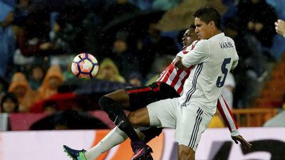 Real Madrid’s Raphael Varane, right, challenges the ball with Inaki Williams of Athletic Bilbao. Juanjo Martin / EPA