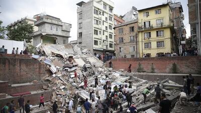 People search for survivors stuck under the rubble of a destroyed building, after an earthquake caused serious damage in Kathmandu, Nepal. Narendra Shrestha / EPA
