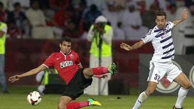 Alex Brosque, right, of Al Ain was powerless to stop the Al Ahli attack during Sunday night's match at Sheikh Rashid Stadium in Dubai. Afsal Sham / Al Ittihad