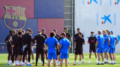 Barca manager Ronald Koeman talks to his squad in training. AFP