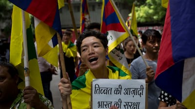Tibetan exiles in New Delhi show support for India on Friday, August 11, 2017 in the border standoff with China .Tensions between Indian and China flared last month in the southernmost part of Tibet, in an area also claimed by Indian ally Bhutan, after Chinese teams began building a road onto the Doklam Plateau. The banner in local language reads Tibet's independence is India's security. Tsering Topgyal /AP