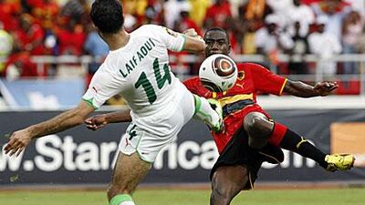 Abdelkader Laifaoui of Algeria, left, is challenged by Djalma of Angola during their game in Luanda.