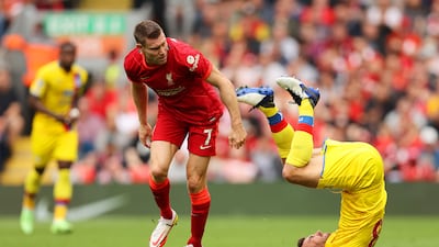 Crystal Palace midfielder James McArthur takes a tumble after a challenge by Liverpool midfielder James Milner. Getty Images