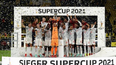 Bayern captain Manuel Neuer lifts the trophy.