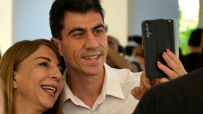 A woman takes a selfie with popular YouTuber and TikToker Fidias Panayiotou in Nicosia, Cyprus, on Tuesday. AP