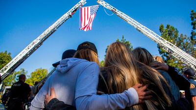 Friends pay tribute to Ventura Country sheriff Sgt Ron Helus who was killed in a shooting at Borderline Bar in Thousand Oaks, California. AFP