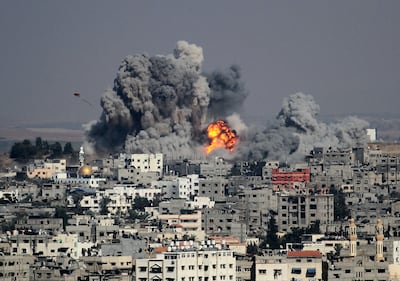 Smoke rises after an attack of Israeli aircraft on Gaza City in 2014. Getty