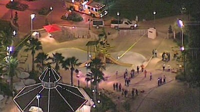 More than 50 officers were searching the Seven Seas Lagoon along with an alligator tracker and two marine units and would continue searching through the night, Orange County sheriff Jerry Demings said. WKMG via AP