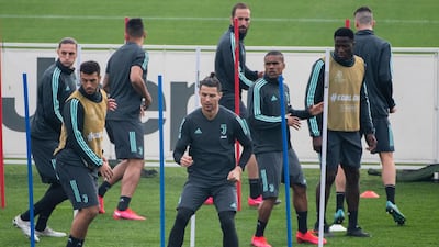 Juventus' Cristiano Ronaldo, centre, training with teammates. AP