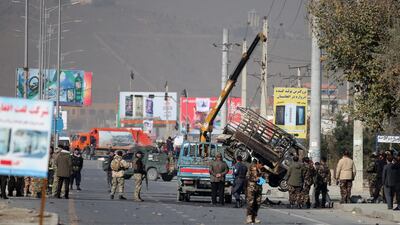 Security personnel inspect a damaged vehicle which was carrying and shooting rockets, in the aftermath of a rocket attack in Kabul, Afghanistan. According to media reports at least three people were killed and 11 others were injured as multiple rockets landed on the Afghann capital. EPA