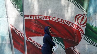 A mural of Iran's national flag. Iran has endured US sanctions imposed in 2018 and aimed at crippling its oil exports. EPA