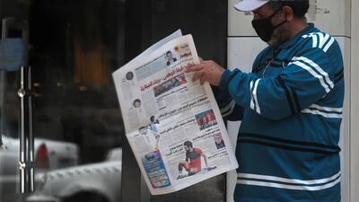 A man reads Al Joumhouria newspaper on a street in central Cairo, Egypt. Reuters