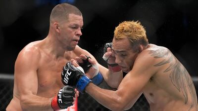 Nate Diaz hits Tony Ferguson in a welterweight bout during UFC 279 on September 10, 2022 in Las Vegas. AP