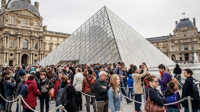 Visitors queue outside the Louvre Museum Pyramid to enter the exhibition of the Italian Renaissance artist Leonardo Da Vinci in Paris. EPA
