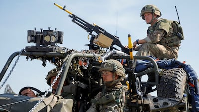 British soldiers prepare for Swift Response 22 exercises carried out by Nato allied troops at Krivolak army base, North Macedonia, on May 12. Reuters