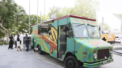 The first patrons gather outside the Toasted Dubai food truck in the parking lot of Dubai Chamber of Commerce. Sarah Dea / The National