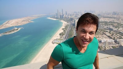 Zumba creator Beto Perez enjoys the view of Abu Dhabi from the helipad of The St Regis Abu Dhabi. Courtesy St Regis