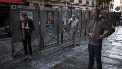 In Paris, voters were lining up early at polling stations. Emilio Morenatti/AP Photo