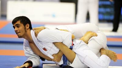 Omar Al Fadhli, left, overcame Mana Al Breiki during the final of men Under 18 66kg final in the President’s Cup Round 3 at Shabab Al Ahli Dubai Club in Dubai. Pawan Singh / The National