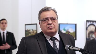 Andrei Karlov, the Russian Ambassador to Turkey, pauses during a speech at a photo exhibition in Ankara. Burhan Ozbilici / AP Photo