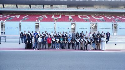 The assembled drivers smile for the camera.