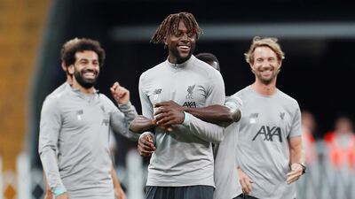 Divock Origi and Salah during training. Action Images via Reuters