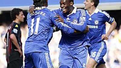 Michael Essien, centre, celebrates what turned out to be the winning goal with Chelsea teammate Didier Drogba.