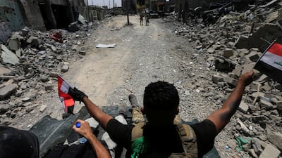 Members of the Emergency Response Division celebrate in the Old City of Mosul, Iraq July 8, 2017. REUTERS/Alaa Al-Marjani