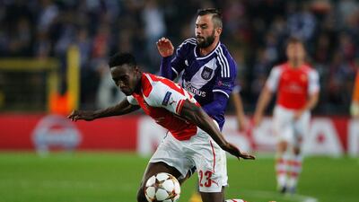 Danny Welbeck of Arsenal battles with Steven Defour of Anderlecht during their Champions League match in Brussels on Wednesday. Dean Mouhtaropoulos / Getty Images