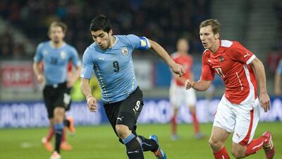 Luis Suarez and Uruguay drew Austria 1-1. They'll play in Group D at the 2014 World Cup against Costa Rica, England and Italy. Winnie Pessentheiner / Getty Images